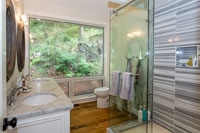 Washroom Accented with Marble Tile & Glass Shower